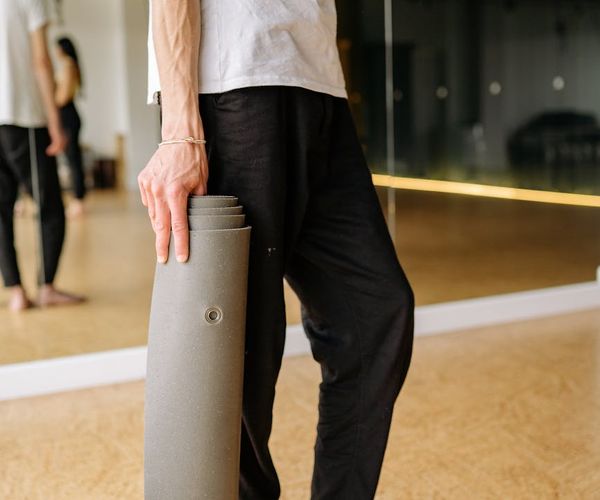 Person holding a challenging yoga pose showing strength and flexibility.